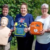 Steve Taylor, Gill Cleeve and Jo Carroll with the new defibrillator. Photo by David Fawbert Photography