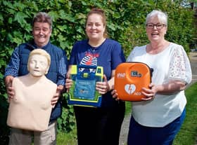 Steve Taylor, Gill Cleeve and Jo Carroll with the new defibrillator. Photo by David Fawbert Photography