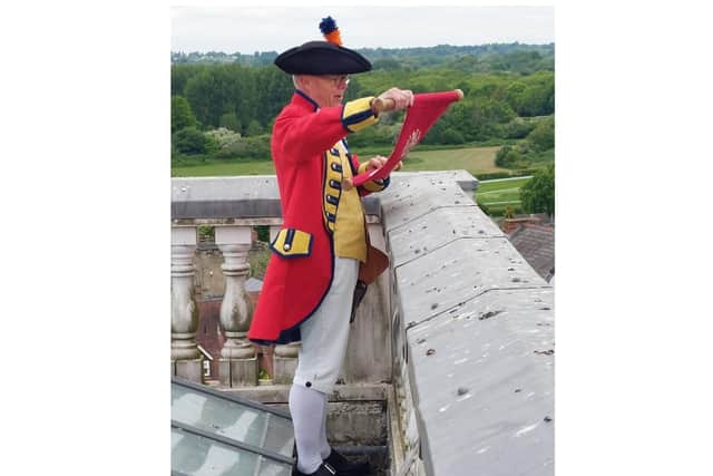 Warwick Town Crier, Michael Reddy on top of the Market Hall Museum. Photo by Warwick Town Council