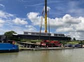Boats are craned in ahead of the show.