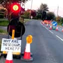 The temporary traffic lights and sign attached to them in Rugby Road, Cubbington. Picture supplied.