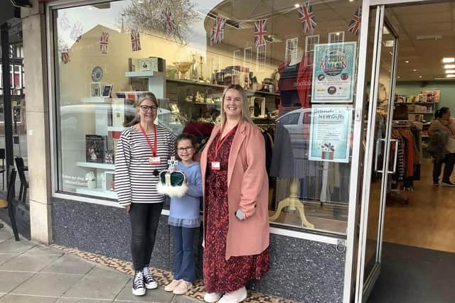 Sophia presents her beautiful crown to the MytonHospice charity shop in Church Street, all ready for the trail.