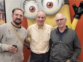 Chris Barrie, who played Rimmer, the pompous hologram in the cult comedy Red Dwarf, at the Rugby launch with father and son fans Benjamin Taylor and dad Colin Taylor.