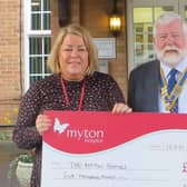Dick Dixon presents £5,000 to Louise Careless of Myton Hospice