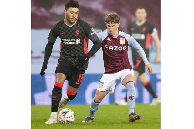 Ted Rowe tussles with Liverpool midfielder Alex Oxlade-Chamberlain on his debut for Aston Villa in the FA Cup third round in January 2021.
