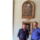 Historian Aaron Manning (left) and art historian Adam Busiakiewicz (right) with the rediscovered portrait of Henry VIII. Photo supplied