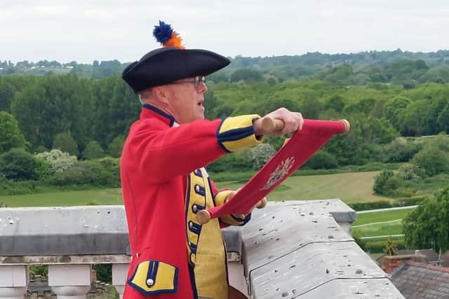 Warwick Town Crier, Michael Reddy reading The VE Day 80 Proclamation from the top of Market Hall Museum. Photo by Warwick Town Council
