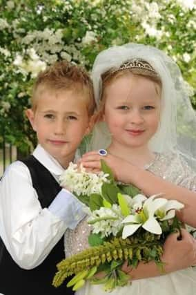 The bride and groom celebrate their special mock wedding at Dunchurch Infant School and Nursery.