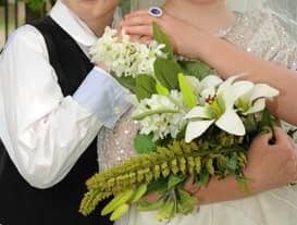 The bride and groom celebrate their special mock wedding at Dunchurch Infant School and Nursery.