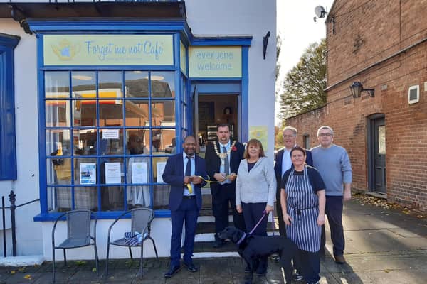 The official opening of the Forget Me Not Cafe carried out by Leamington Mayor Cllr Nick Wilkins who is pictured with owners Fran Scott and Steve Cooper and those who have played a part in the successful launch and running of the cafe since it opened in July.