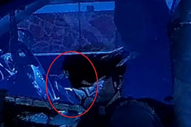 A driver using a handheld mobile phone during Operation Snap on April 24.