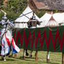 Knights try to unseat their opponent during the joust