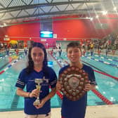 Proud captains Sam Mann and Ellie Watson colleCT the trophy on behalf of the team. Pic: LSASC