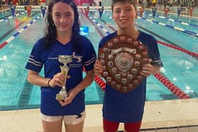 Proud captains Sam Mann and Ellie Watson colleCT the trophy on behalf of the team. Pic: LSASC