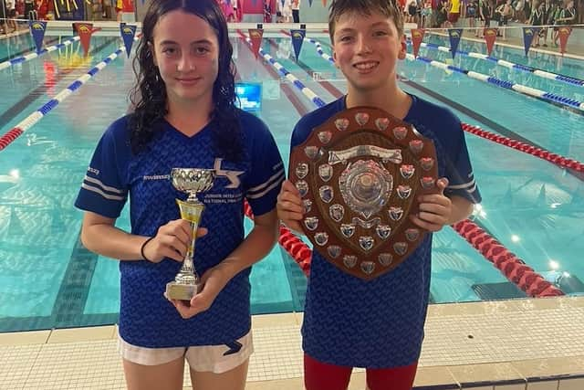 Proud captains Sam Mann and Ellie Watson colleCT the trophy on behalf of the team. Pic: LSASC