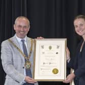 Rugby Mayor Simon Ward presents Olympic gold medallist Lauren Henry with the Freedom of the Borough.