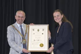 Rugby Mayor Simon Ward presents Olympic gold medallist Lauren Henry with the Freedom of the Borough.