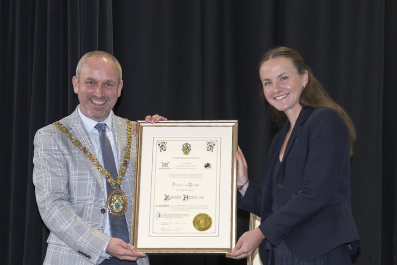 Rugby Mayor Simon Ward presents Olympic gold medallist Lauren Henry with the Freedom of the Borough.