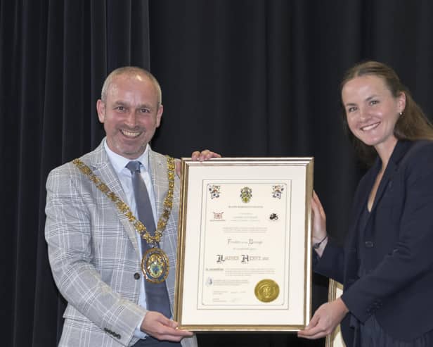 Rugby Mayor Simon Ward presents Olympic gold medallist Lauren Henry with the Freedom of the Borough.