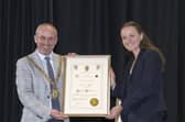 Rugby Mayor Simon Ward presents Olympic gold medallist Lauren Henry with the Freedom of the Borough.