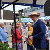 A photograph of the High Sheriff of Warwickshire, David Kelham, visiting Kenilworth in Bloom’s stall at Kenilworth’s Jubilee Market in Talisman Square. Picture submitted.