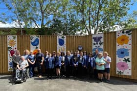 Campion School children, who created the artwork, with Allsopp Ward staff and patient Andrew Whiteford and his family. Photo supplied