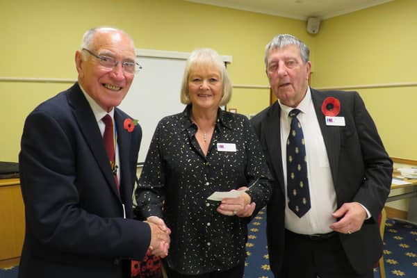 Warwick Rotary Club President Keith Talbot (left) with Lynne and Alan White from Galanos House in Southam. Photo supplied