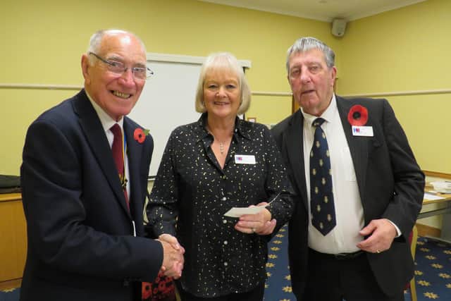 Warwick Rotary Club President Keith Talbot (left) with Lynne and Alan White from Galanos House in Southam. Photo supplied