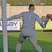 David Kolodynski volleys home his second goal in Rugby’s 4-0 win at Oadby. Picture by Martin Pulley