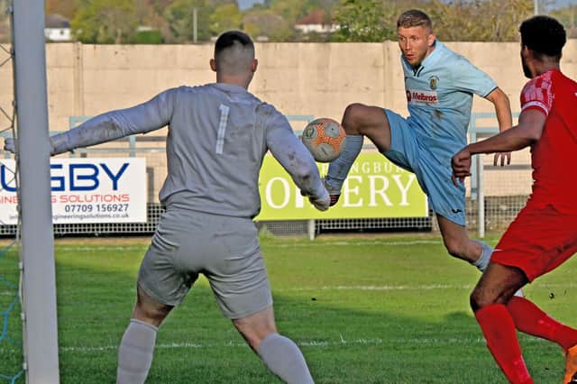 David Kolodynski volleys home his second goal in Rugby’s 4-0 win at Oadby. Picture by Martin Pulley