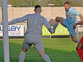 David Kolodynski volleys home his second goal in Rugby’s 4-0 win at Oadby. Picture by Martin Pulley