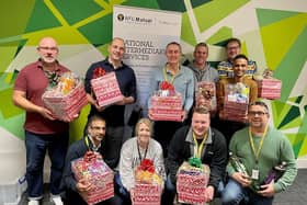 Employees at NFU Mutual with the Christmas hampers they made for Derventio Housing Trust residents
