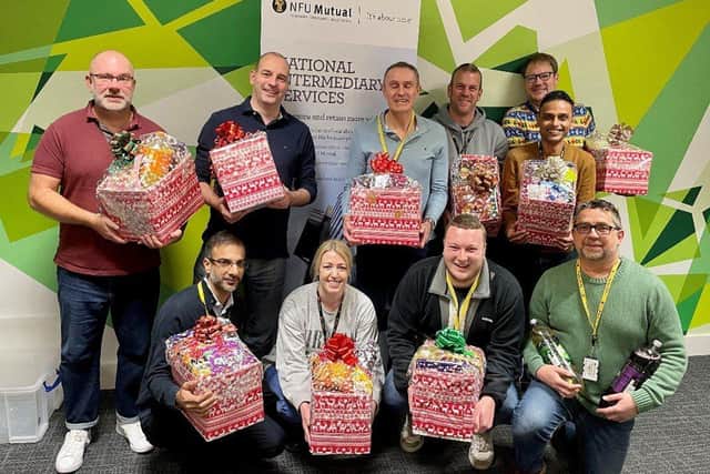 Employees at NFU Mutual with the Christmas hampers they made for Derventio Housing Trust residents