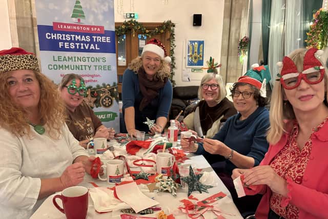 Volunteers prepare for the Make, Take and Share workshops, led by local artist Nicci Selby (centre). Photo by Whittle Productions