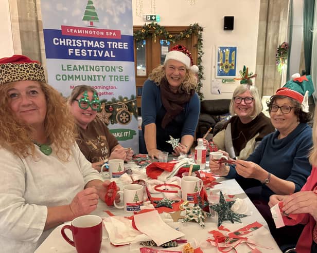 Volunteers prepare for the Make, Take and Share workshops, led by local artist Nicci Selby (centre). Photo by Whittle Productions