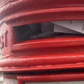 The red post box in Willes Road is overflowing.