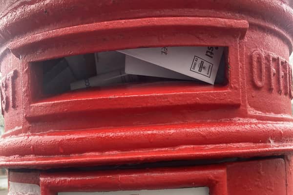 The red post box in Willes Road is overflowing.