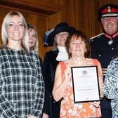 Volunteers from Rugby Autism Network receive their award at the presentation.