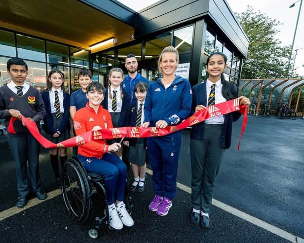 The new Aldi store opens its doors with help from Team GB's Alex Danson and Paralympian Lauren Rowles.
Manager Callum Hadley welcomes children from St Patricks Catholic Primary School to open the store. With a small group of shoppers arriving for the store to open.
