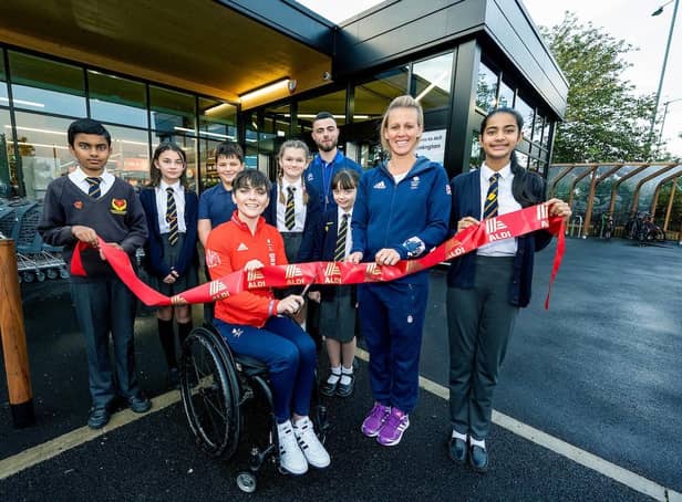 The new Aldi store opens its doors with help from Team GB's Alex Danson and Paralympian Lauren Rowles.
Manager Callum Hadley welcomes children from St Patricks Catholic Primary School to open the store. With a small group of shoppers arriving for the store to open.
