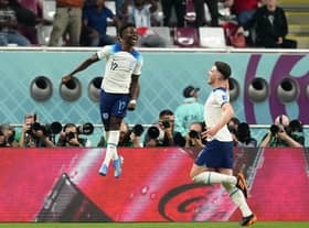 I'LL SECOND THAT: England's Bukayo Saka celebrates scoring the second goal against Group B rivals Iran with Declan Rice (right) at the Khalifa International Stadium. Picture: Nick Potts/PA