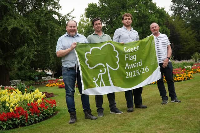 Cllr Will Roberts (left) with officers from the Council's Green Spaces team.