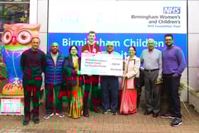 The Rugby branch of the Shree Prajapati Association (SPA) hands over the money to the Birmingham Children's Hospital.
