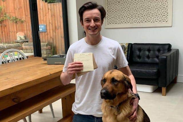 Russell Peake with guide dog Fred, a Golden Retriever cross German Shepherd.