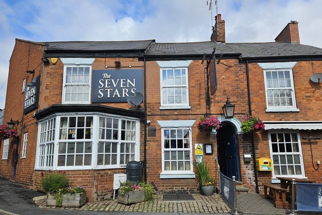 Seven Stars, Albert Square, Rugby. The guide said: "Traditional multi-roomed community pub with a focus onquality beer and cider. Its 14 handpumps dispense an
ever-changing selection of light and dark ales, plus four ciders, which are augmented by six craft beers."