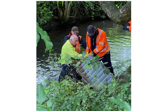 Volunteers discovered a washing machine that had been fly-tipped in the River Sowe. Photo by Severn Trent