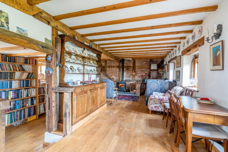 The living room and connected study. Photo by DM & Co. Homes