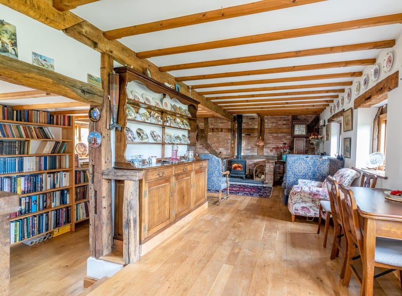The living room and connected study. Photo by DM & Co. Homes