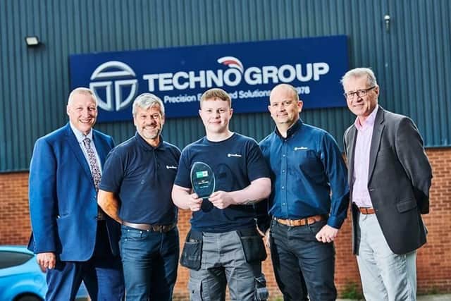 Mark Pawsey MP (right), Apprentice of the Year Tyler Gillespie (centre) and the Technoset team