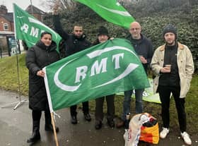 Members of the RMT union opposite the main entrance to Rugby station this morning, Tuesday, January 3.